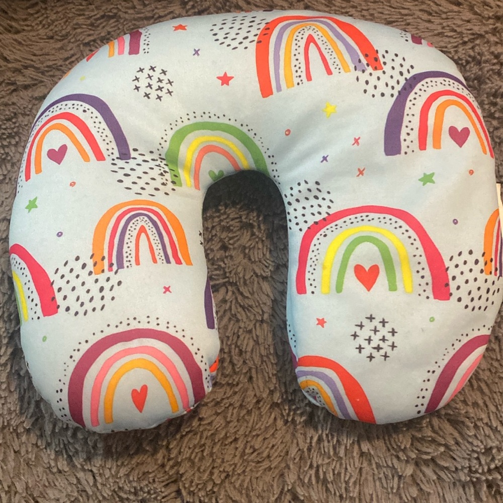 It’s a rainbow neck pillow for little kids